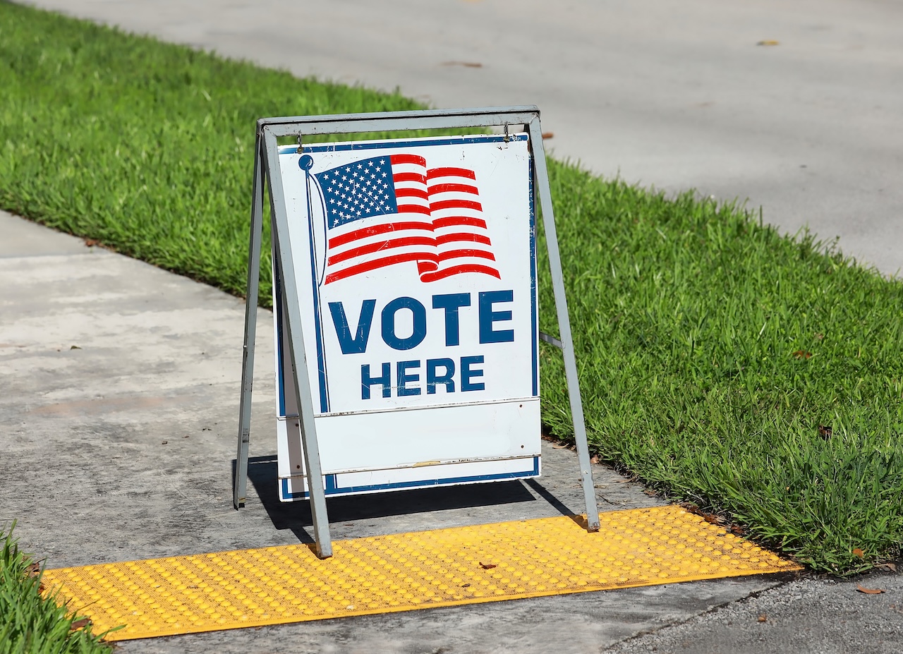 Vote Here Sign placed on the walkway to a neighborhood polling place, as seen on election day in Fort Lauderdale, Florida, USA